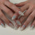 Künstliche Nagelkunst mit floralen und dekorativen Elementen Brehn
