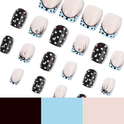 Kunstvolle Nagelverlängerungen mit verspielten Punkten und elegantem Design Brehn