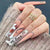 Kunstnagelset mit romantischen Herz- und Glitzerverzierungen Brehn