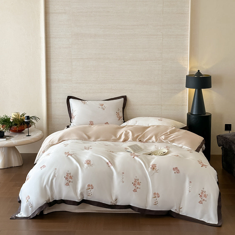 Feines Satin-Bettbezug-Set mit zarter Blumenstickerei und eleganter Paspelierung