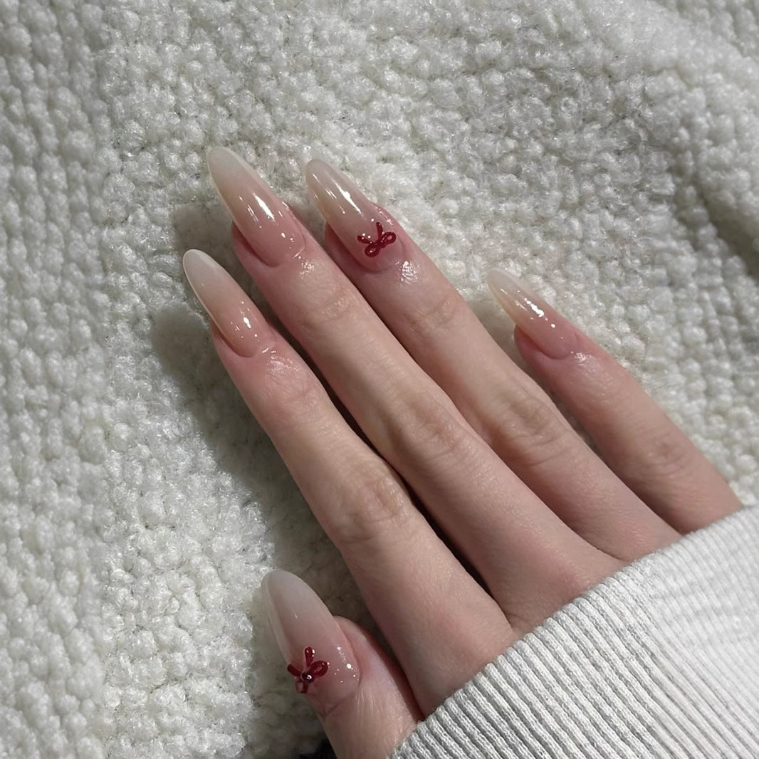 Elegante Stiletto Press-On Nägel mit dekorativen Schleifenakzenten Brehn