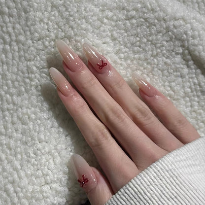 Elegante Stiletto Press-On Nägel mit dekorativen Schleifenakzenten Brehn