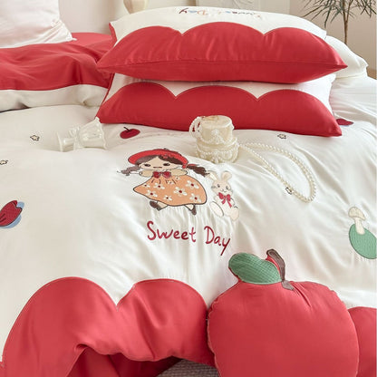 Bettwäsche-Set mit bestickten Puppen- und Apfelmotiven