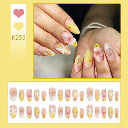 Kunstnägel mit floralem Glitzermuster Brehn