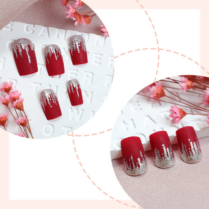 Künstlerisches Press-On Nail Set mit Silber Tropfen Design Brehn