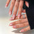 Dekorative Press-On Nagelkunst Set mit Herz- und Schleifendesigns Brehn