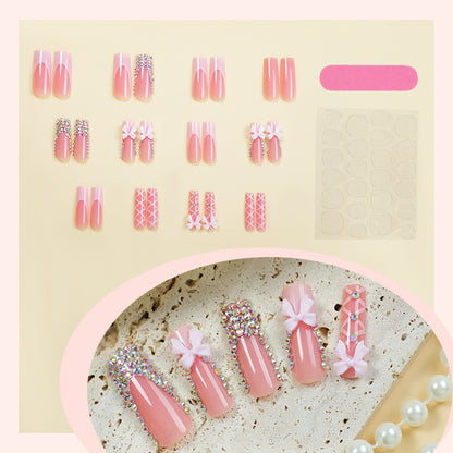 Kunstnagelset mit eleganten Schleifen- und Glitzerakzenten Brehn