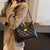 Gepolsterte Schultertasche mit Kettendetail Brehn