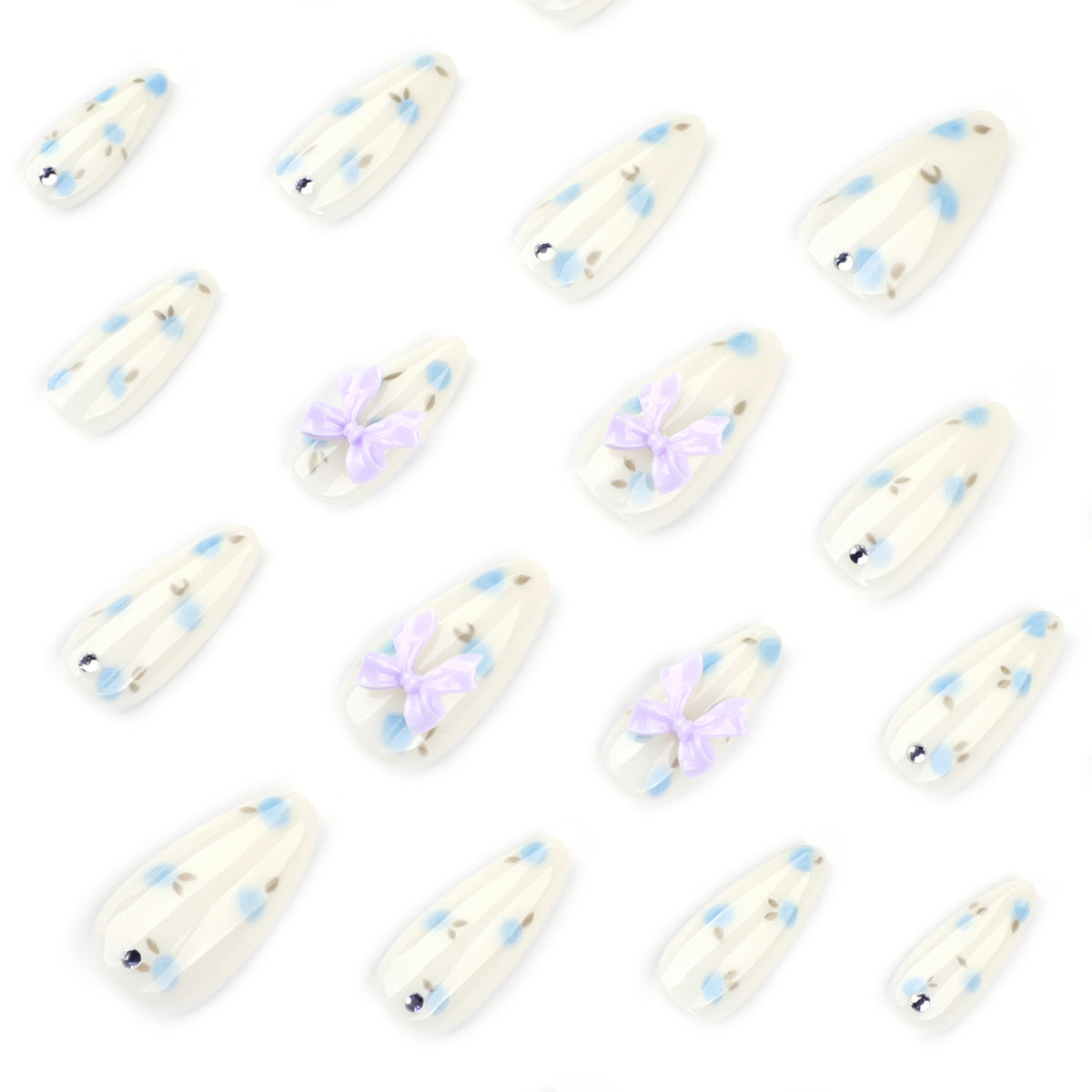 Kunstvolle Stiletto-Nägel mit zarten Blütenmotiven und Glitzerakzenten Brehn