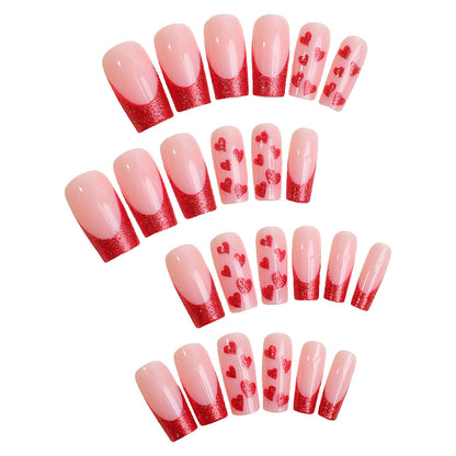 Kunstnagelset mit romantischen Herz-Designs und Glitzerakzenten Brehn