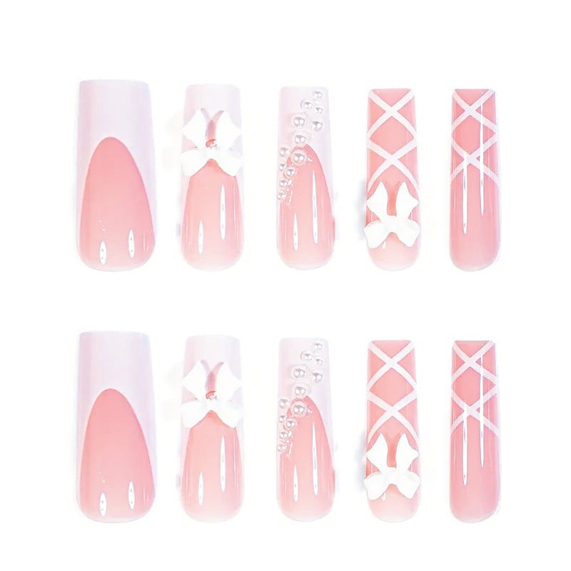 Kunstnagelset mit eleganten 3D- Schleifen und Perlenverzierungen Brehn