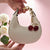 Trendige Handtasche mit Fruchtigem Anhänger Brehn