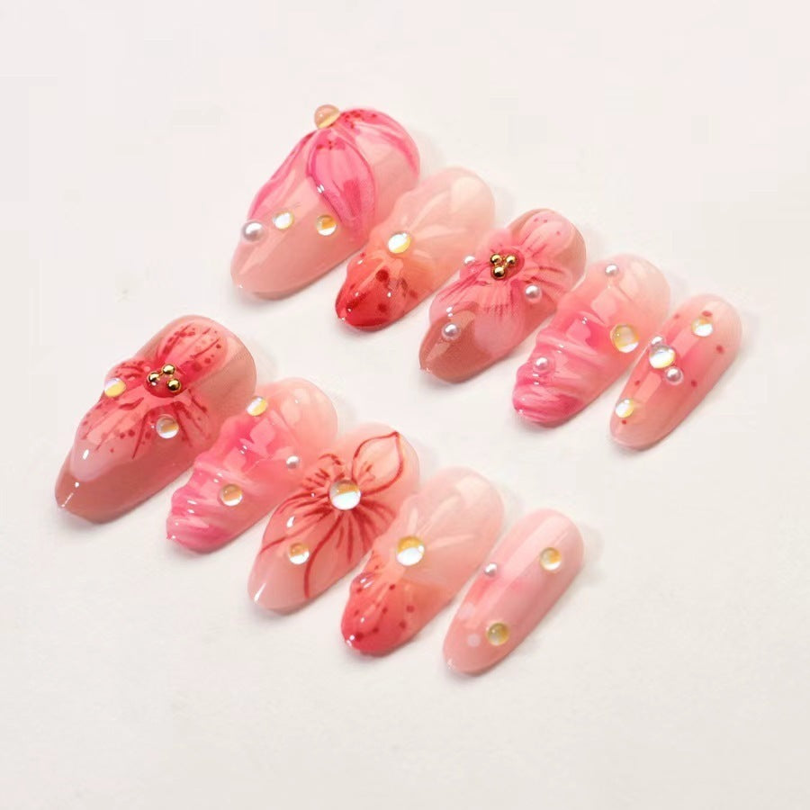 Kunstnagelset mit floralen Designs und funkelnden Akzenten Brehn
