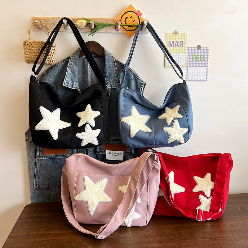 Lässige mit Sternen verzierte Schultertasche