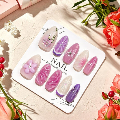 Dekorative Kunstnägel mit floralen Designs und Glitzerakzenten Brehn