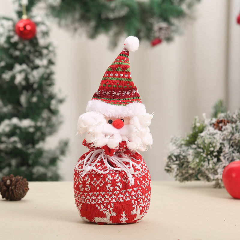 Niedlicher Weihnachtsgnom mit Geschenkesack Brehn