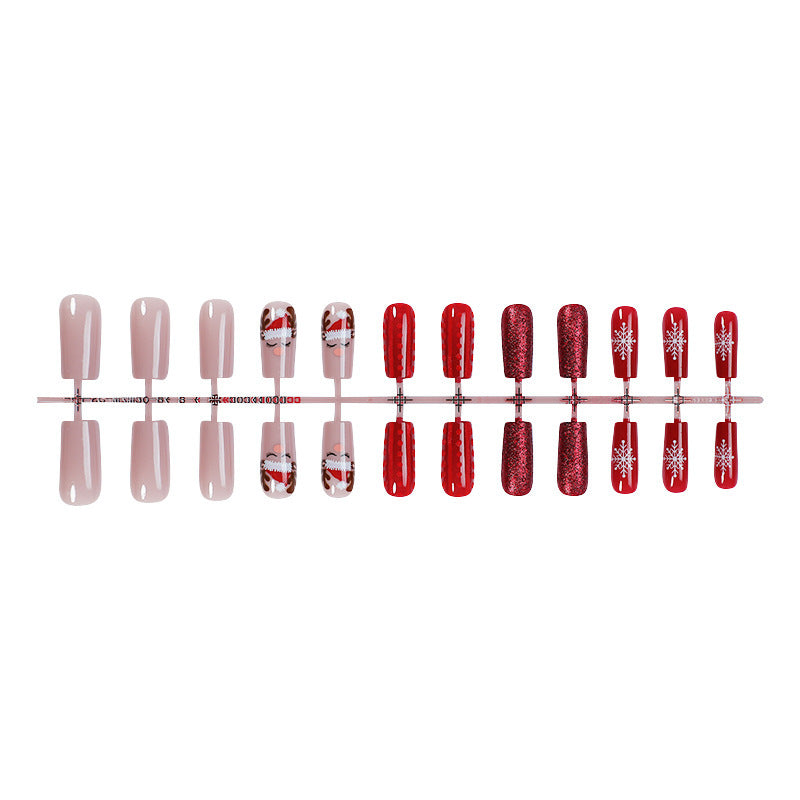 Kunstnagelset mit festlichen Weihnachtsmotiven und Glitzerakzenten Brehn