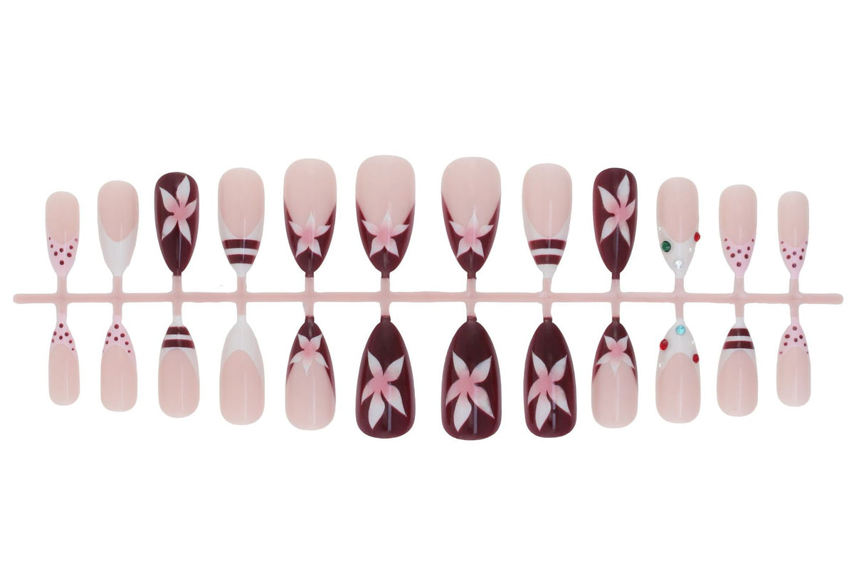 Kunstnagelset mit floralem Design und Glitzerakzenten Brehn