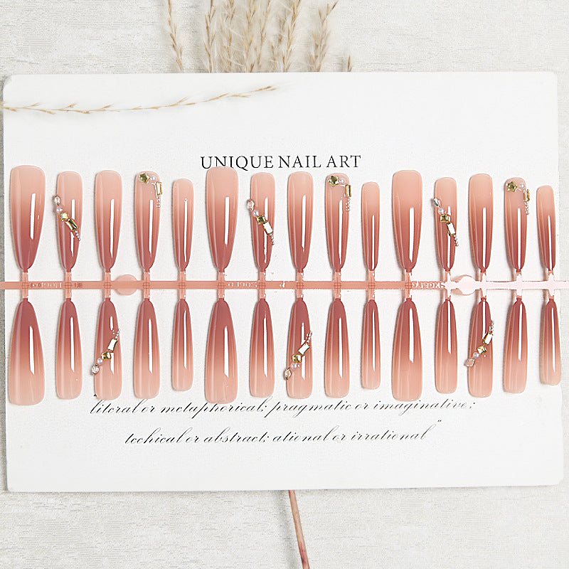 Kunstnagelset mit elegantem Ombre-Effekt und glamourösen Verzierungen Brehn