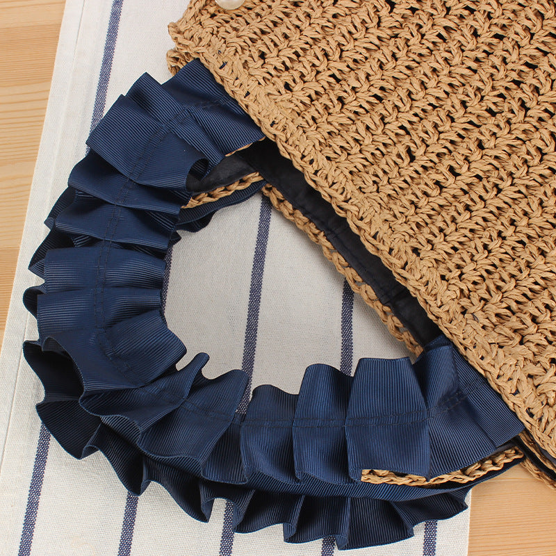 Elegante Handtasche mit Perlenverzierung und Rüschengriff Brehn