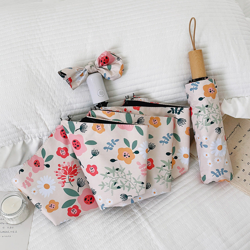 Damen Faltbarer Regenschirm mit floralem Design und niedlichen Details Brehn