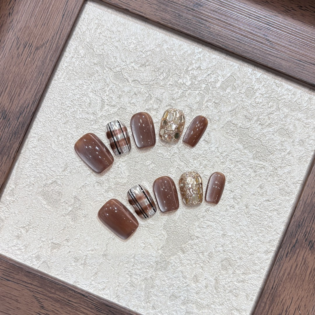 Kunstnägel-Set mit Glitzer- und Goldakzenten Brehn