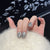 Künstlerisches Press-On Nagelset mit verspielten Charakterdesigns Brehn