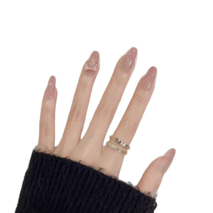 Dekoratives Nagelkunst Press-On Set mit Glitzerakzenten