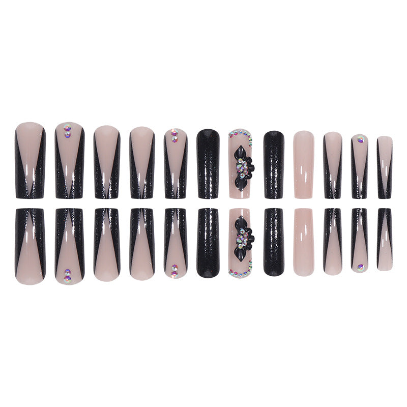 Glamouröse Lange Stiletto Press-On Nägel mit Glitzer und Blütenakzenten Brehn