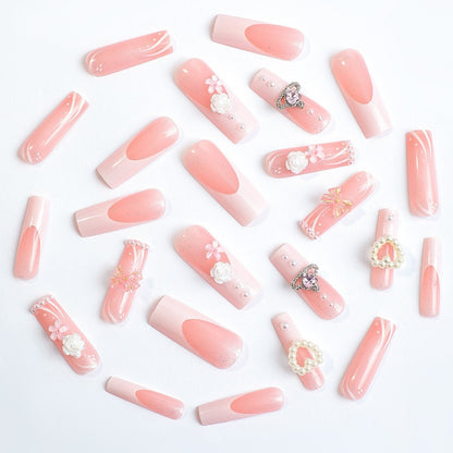 Elegantes Kunstnagelset mit Glitzer- und Blumenakzenten Brehn