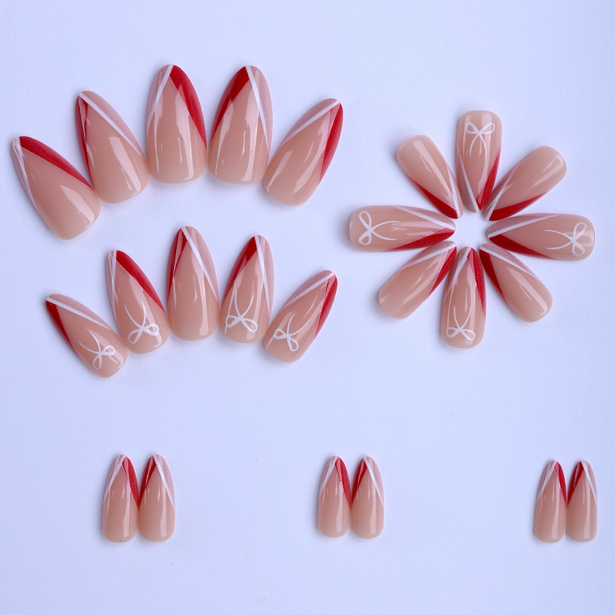 Kunstfingernägel Im Eleganten Stiletto-Design mit Schleifen-Akzenten Brehn
