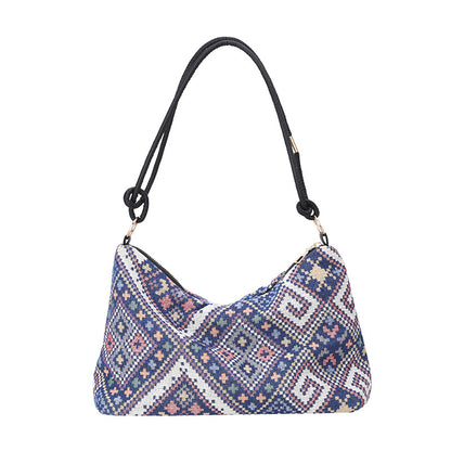 Gepunktete Schultertasche