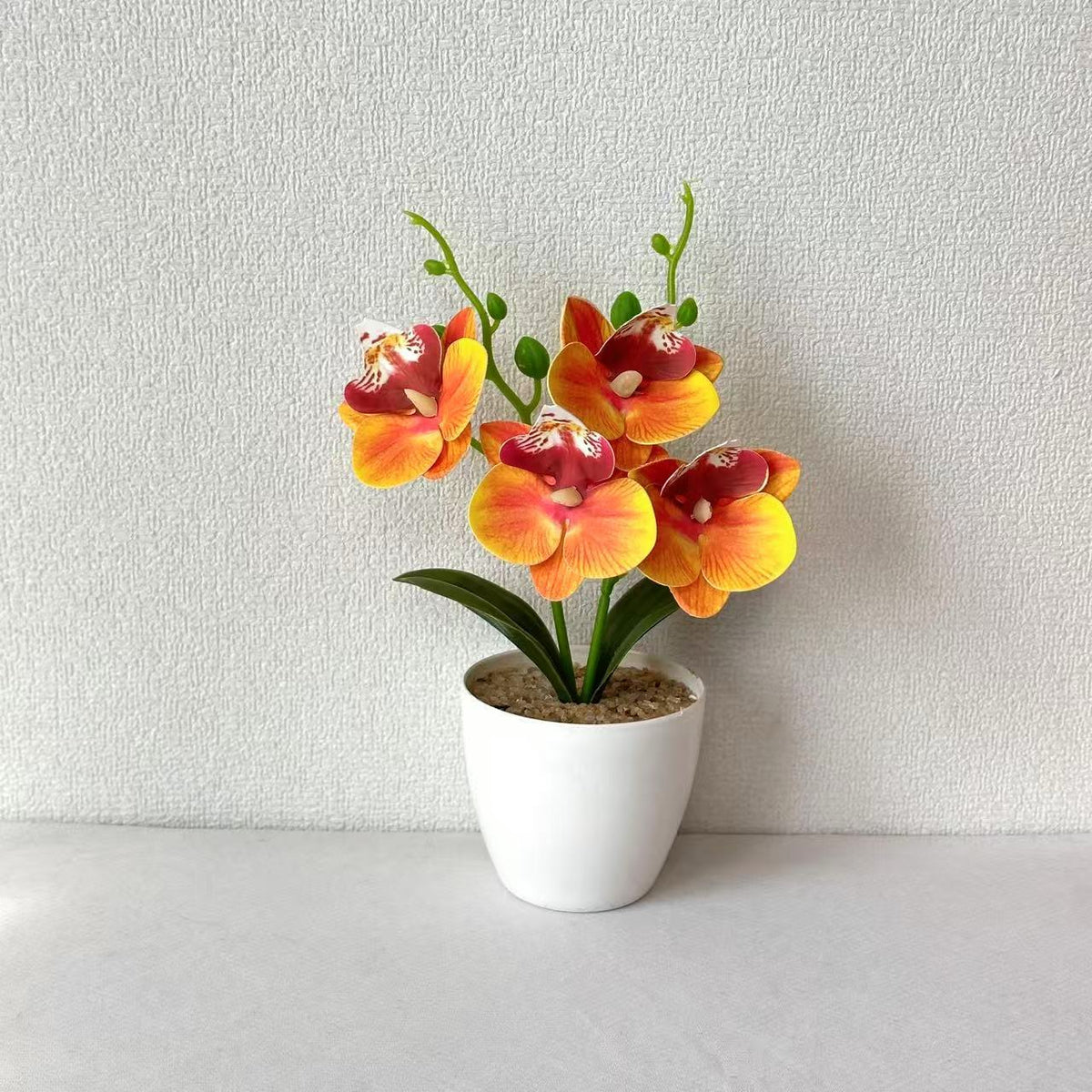 Elegante synthetische Orchideenarrangement