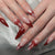 Hochwertiges Kunstnagelset mit eleganten Spitzen und Schleifenverzierungen Brehn