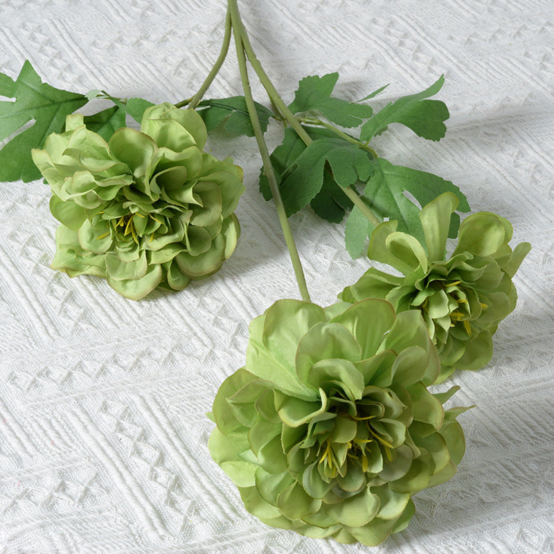 Künstliches Blumenarrangement mit Ringelblumen