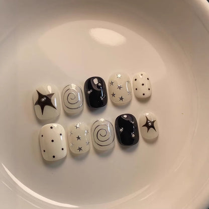 Künstlerisches Press-On Nagelset mit Stern- und Wirbel-Designs