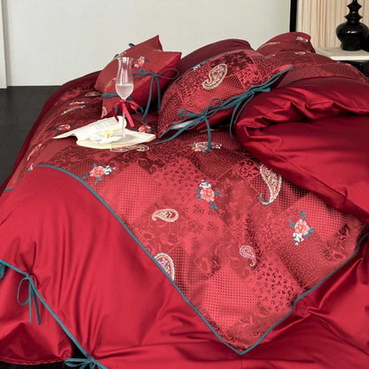Wendbare Bettwäsche-Garnitur aus Baumwollsatin mit Paisley-Patchwork und Zierbändern