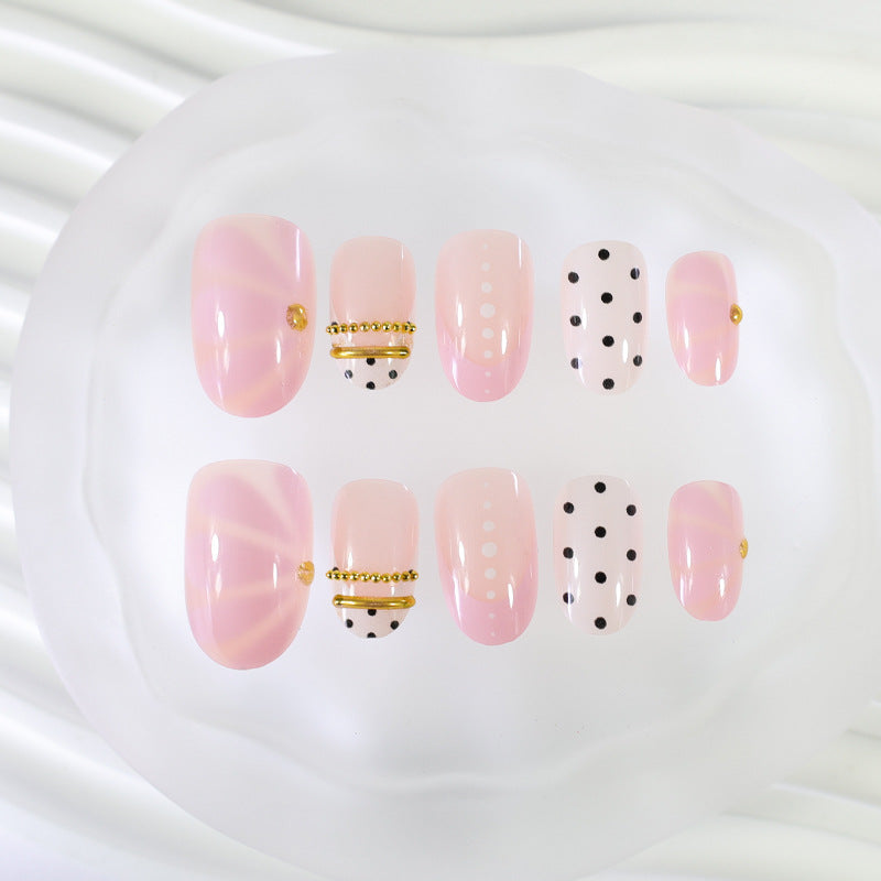 Kunstnagelset mit elegantem Polka-Dot und glamourösen goldenen Akzenten Brehn