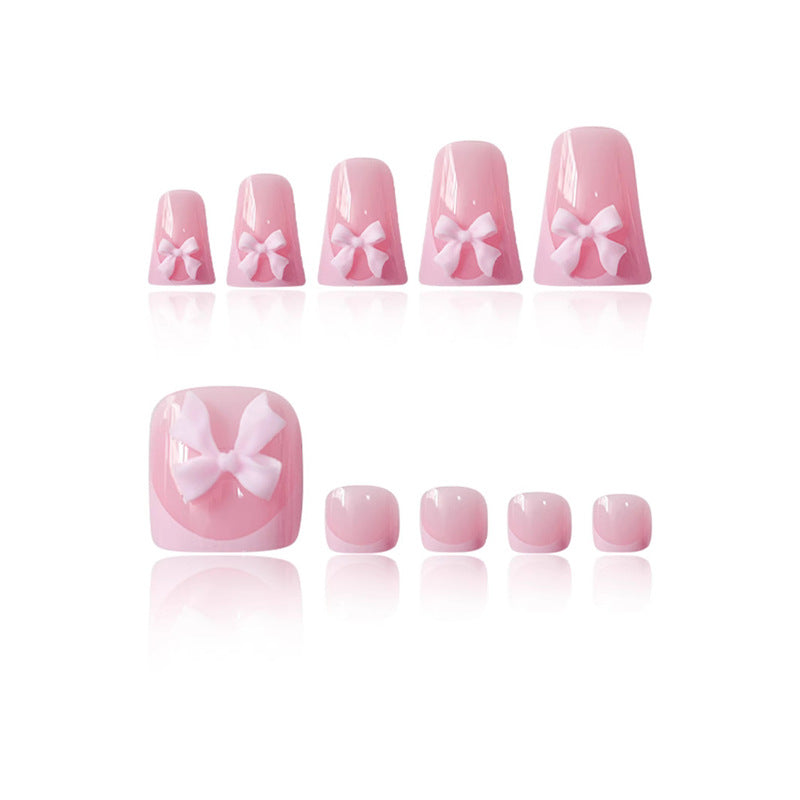 Dekorative Press-On Nagelkunst mit Schleifenakzenten Brehn