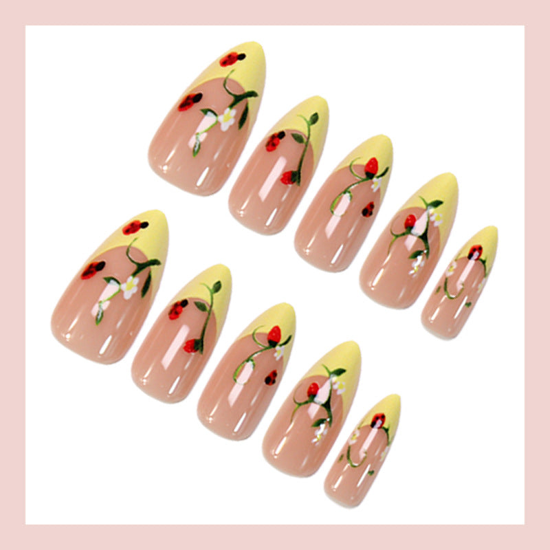 Kunstnagelset mit elegantem Farbverlauf und floralen Akzenten Brehn