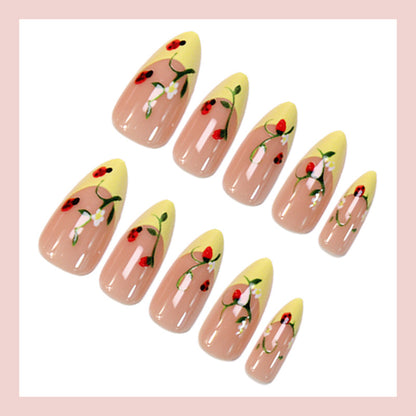 Kunstnagelset mit elegantem Farbverlauf und floralen Akzenten Brehn