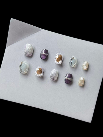 Künstlerisches Press-On Nagelkunst Set mit einzigartigen Texturen und Perlenakzenten