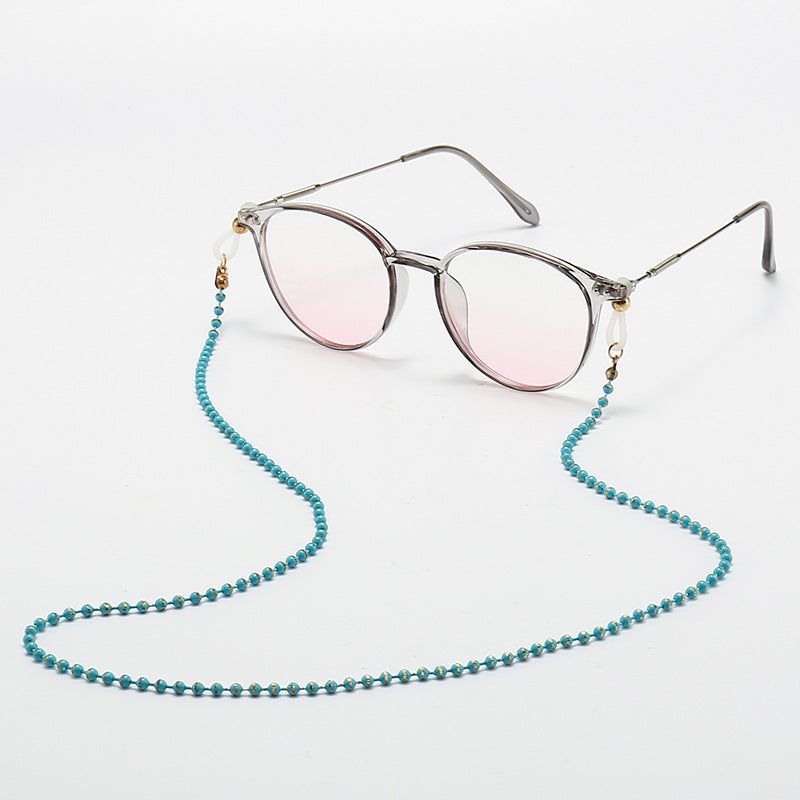 Modische Katzenaugenbrille mit Perlenkette Brehn