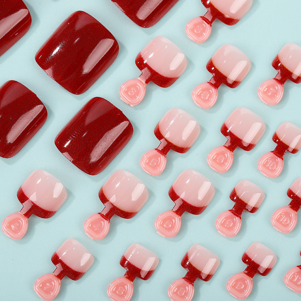 Kunstnagelset im eleganten Rot- und Nude-Design Brehn