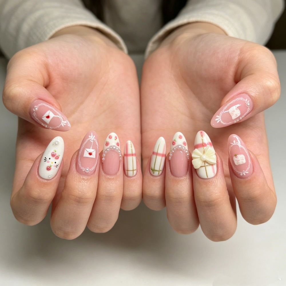 Dekoratives Press-On Nagelkunstset mit Blumen- und Schleifendesigns Brehn