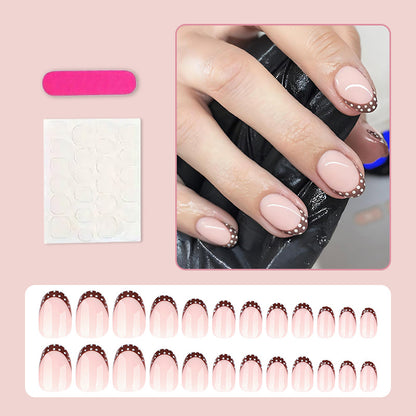 Kunstnagelset mit eleganten französischen Spitzen und dezenten Punkten Brehn
