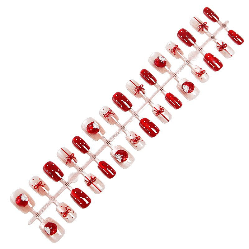 Kunstnagelset mit festlichem Geschenk-Design und eleganten Glitzer-Akzenten Brehn