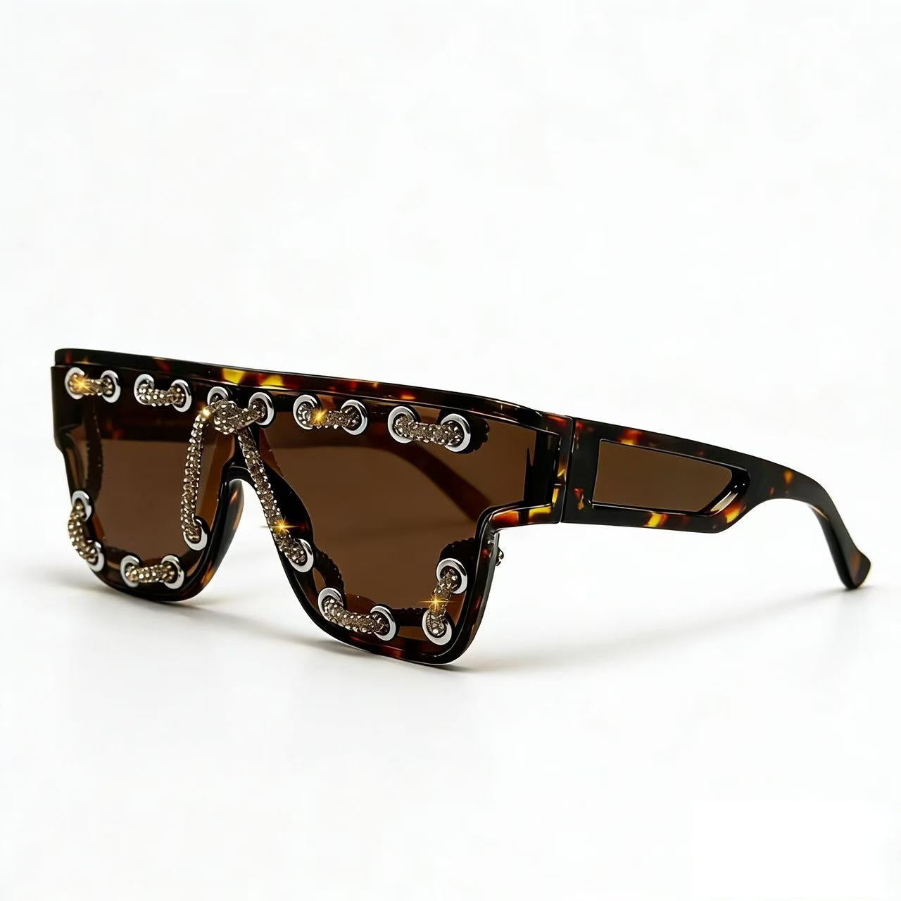 Damen Sonnenbrille mit extravagantem Design und dekorativer Kettenverzierung Brehn