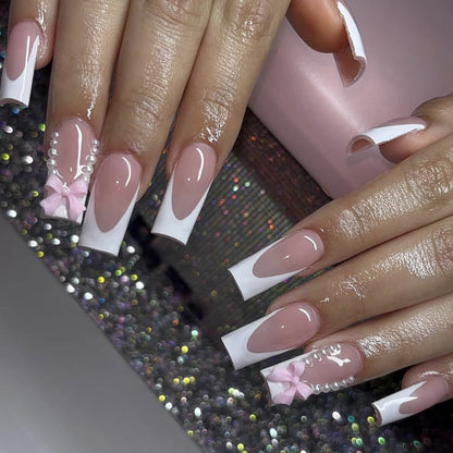 Elegante Stiletto-Nagelkunstverlängerungen mit Perlen- und Schleifenakzenten Brehn