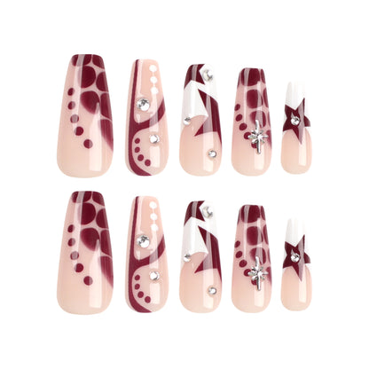 Kunstvolle Nagelverlängerungen mit Glitzer und Sternenmotiven Brehn